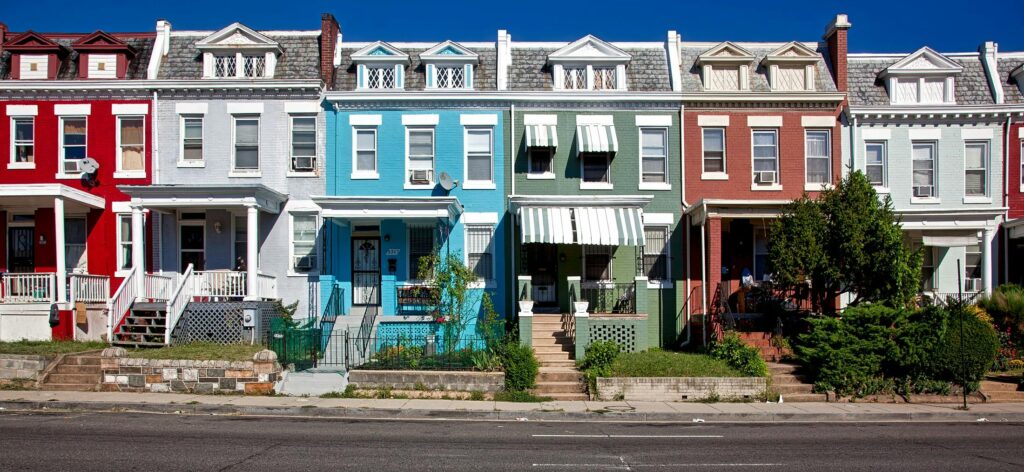 Vibrant row houses on a sunny street capturing urban architecture and charm.